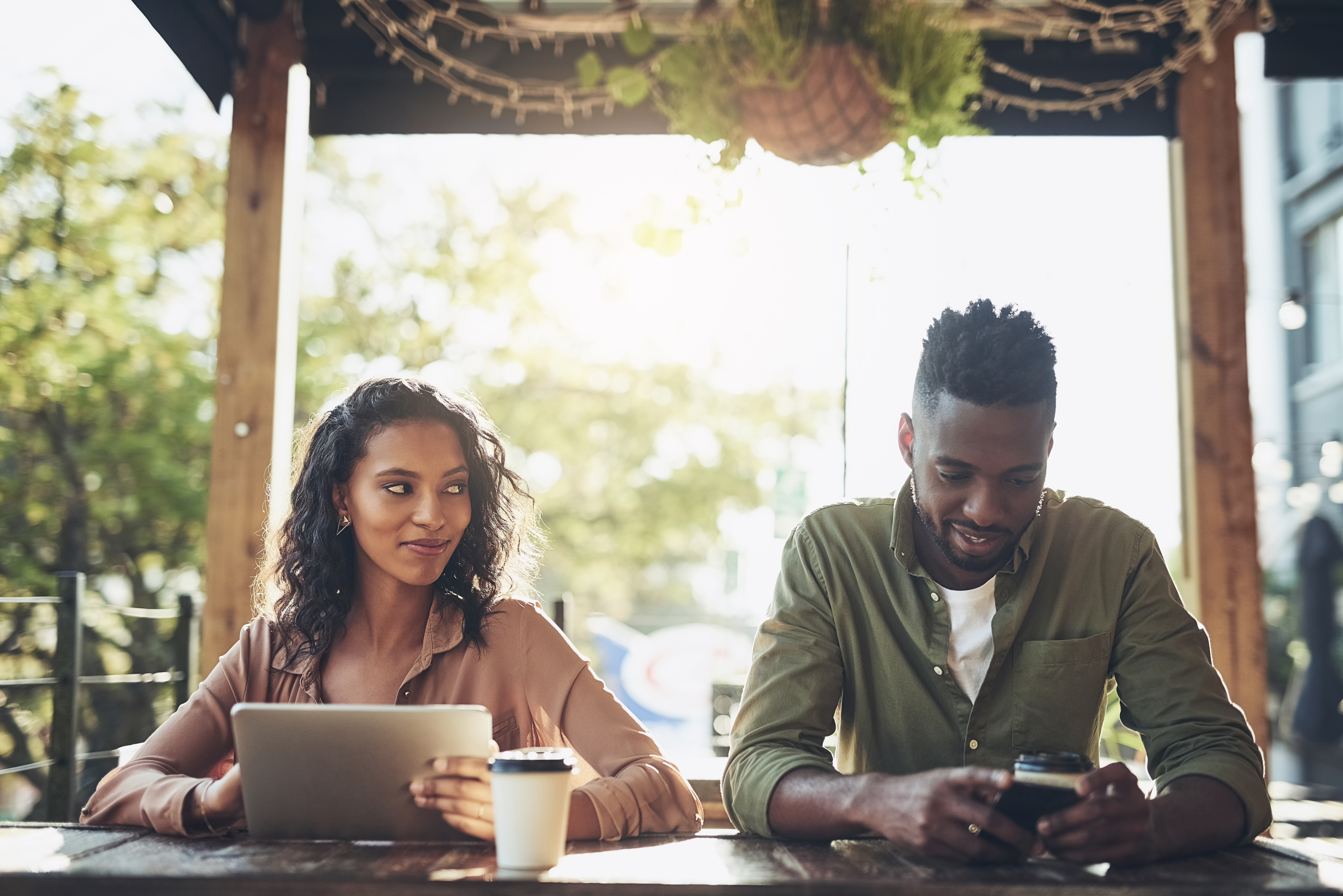 Young black couple sitting next to each other