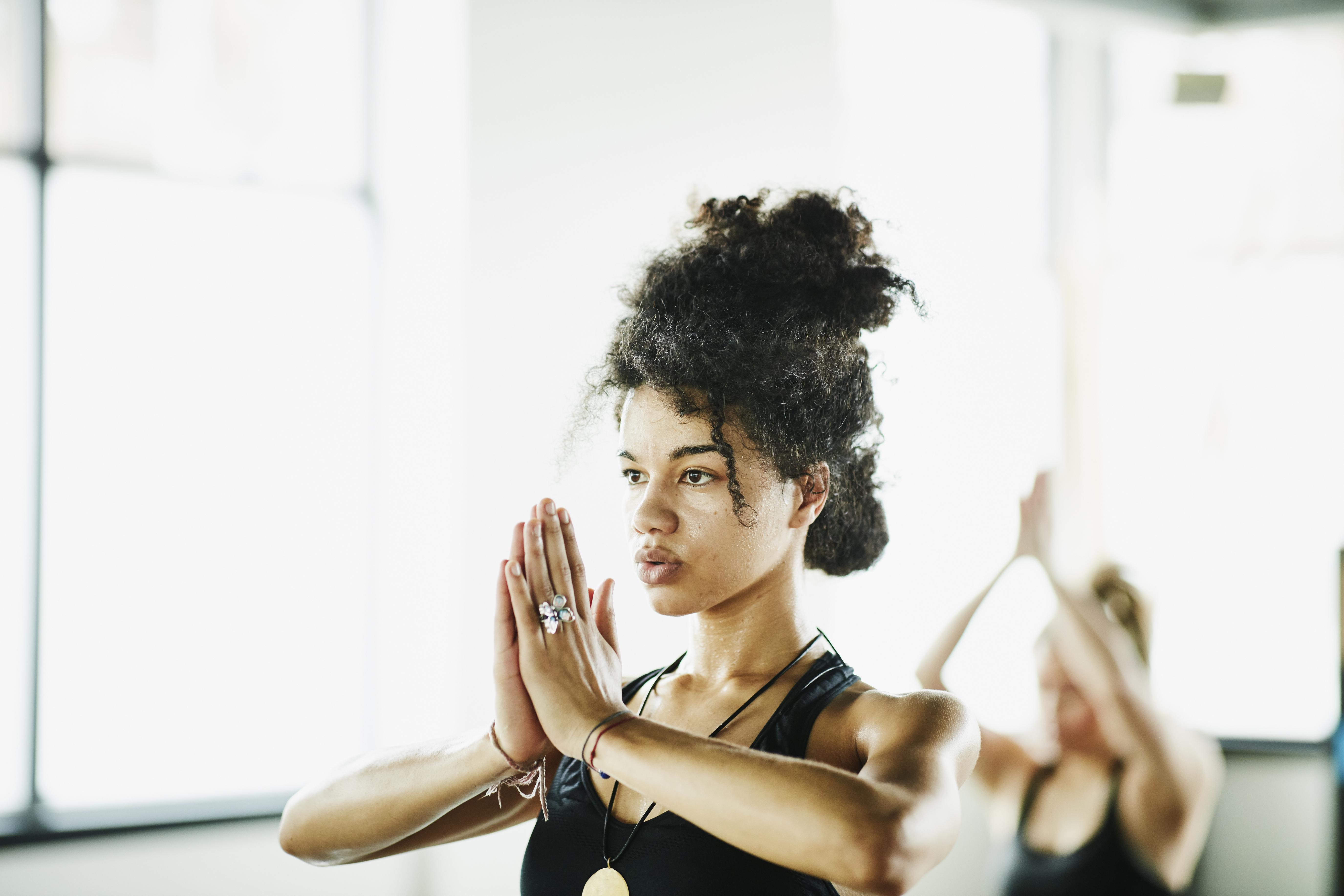 Mixed woman in yoga class